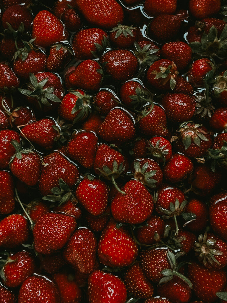 Fresh strawberries on in farmhouse sink